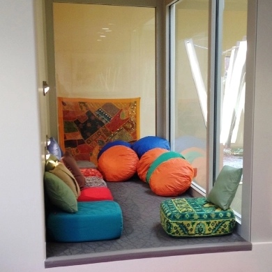 A room filled with comfortable seating at a modular school